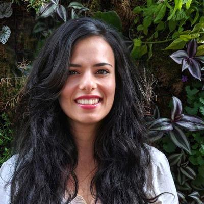 woman in front of plants